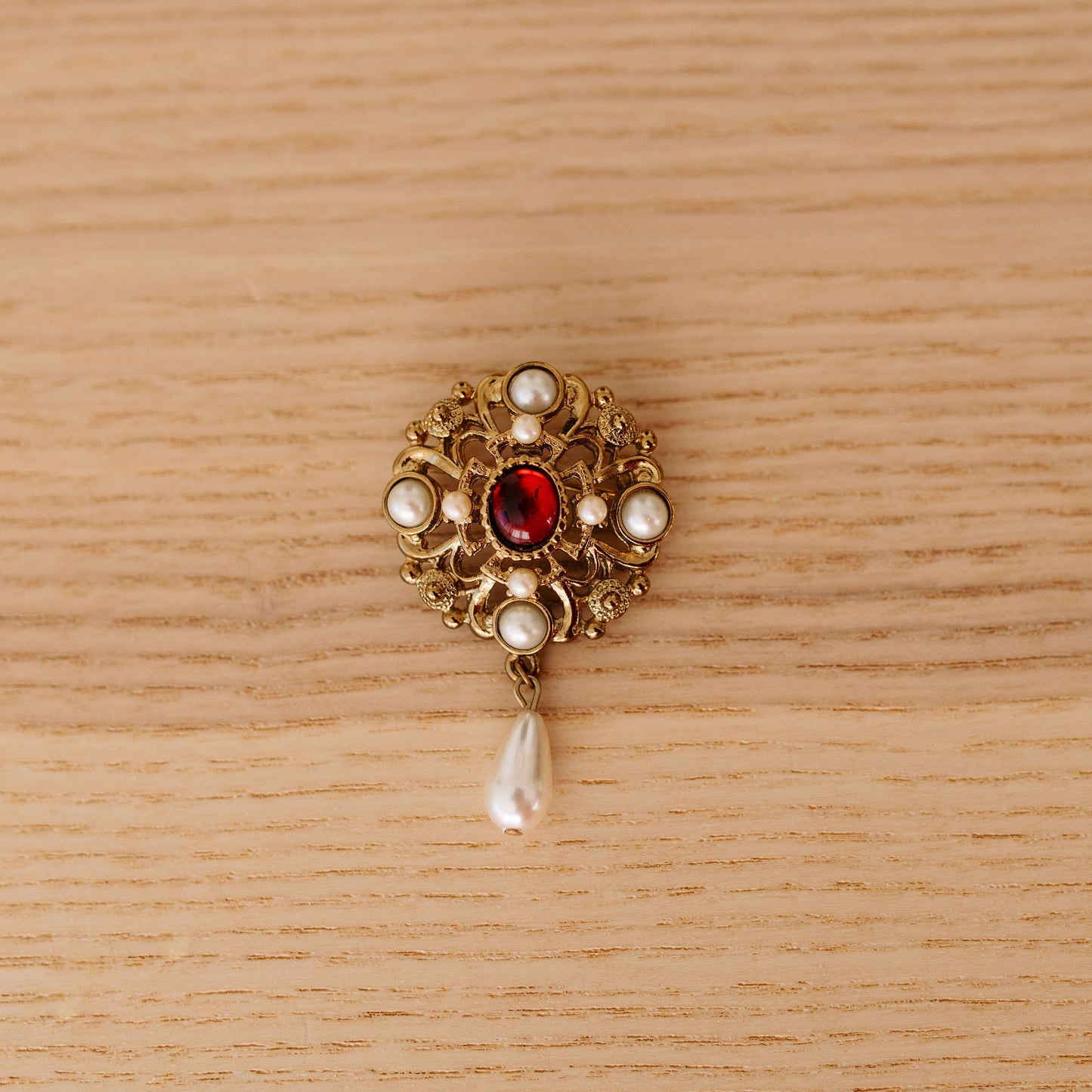 Playful Broach with Red and Pearl Like Drop